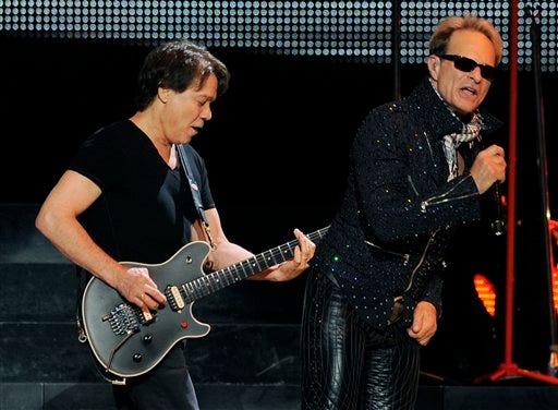 Eddie Van Halen, left, and David Lee Roth of Van Halen perform on Friday June 1, 2012 in Los Angeles.