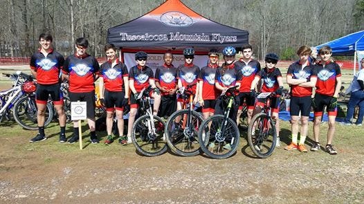The Tuscaloosa Mountain Flyers pose for a picture during a race at Tannehill State Park on March 15. Tuscaloosa will host the state championships in May. Because no single area school had enough racers (five) to officially field a team, the area kids from various middle and high schools came together to form the Tuscaloosa Mountain Flyers. They compete in the Alabama High School Cycling League.