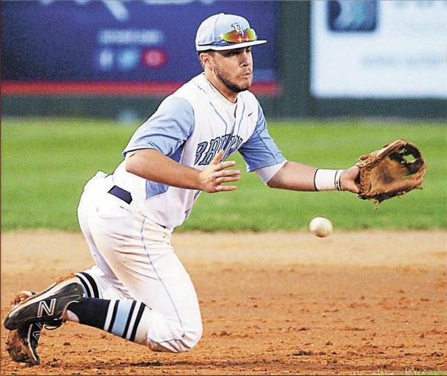 Bartlesville High School third baseman Chase Fiddler hustles to his knees to try to make a play during Tuesday’s varsity baseball showdown against Sand Springs, at Bill Doenges Memorial Stadium. Bartlesville won, 5-2, to post its first back-to-back wins of the season. Becky Burch/Examiner-Enterprise 
 Bartlesville High School sophomore baserunner A.J. Archambo, right, powers into the bag during Tuesday’s varsity baseball battle against the Sand Springs High School Sandites, at Bill Doenges Memorial Stadium. Archambo delivered a key triple to help the Bruins rally from a 2-1 deficit and defeat Sand Springs, 5-2. Next up, Bartlesville plays host Thursday through Saturday to the Bruin Classic. The Bruins will play at 2:30 p.m. and 7:30 p.m. Thursday. Becky Burch/Examiner-Enterprise
