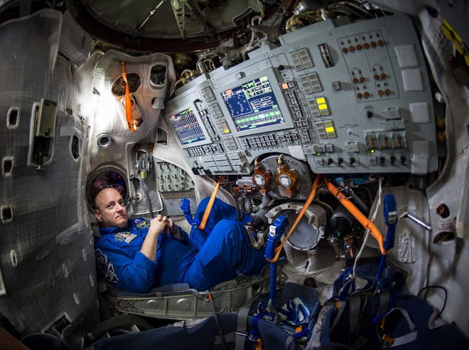 In this photo provided by NASA, astronaut Scott Kelly sits inside a Soyuz simulator at the Gagarin Cosmonaut Training Center (GCTC), Wednesday, March 4, 2015 in Star City, Russia. On Saturday, March 28, 2015, Kelly and cosmonaut Mikhail Kornienko will travel to the International Space Station to begin a year-long mission living in orbit. (AP Photo/NASA, Bill Ingalls)
