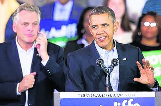 President Barack Obama appears at a campaign rally for Virginia Democratic 
gubernatorial candidate Terry McAuliffe, left, at a high school in Arlington 
in November 2013.
AP FILE / 2013