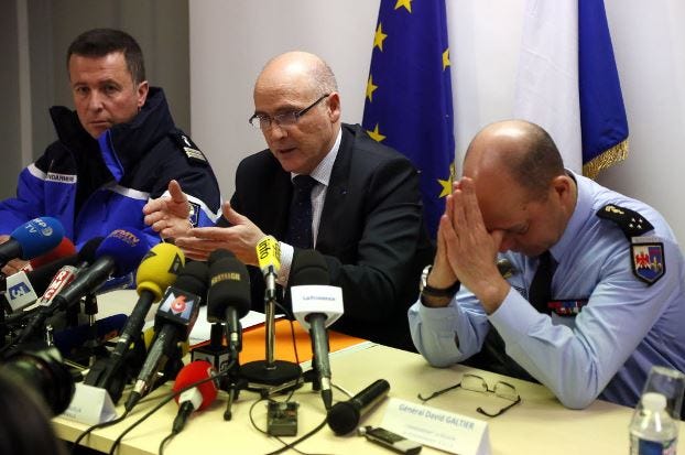 Marseille prosecutor Brice Robin, center, with Gen. David Galtier, right,holds a press conference in Marseille, southern France, Thursday March 26, 2015. Robin said the co-pilot was alone at the controls of the Germanwings flight that slammed into an Alpine mountainside and "intentionally" sent the plane into the doomed descent, killing 150 people.