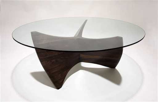 Aaron Scott, who began experimenting with stacked and laminated wood about 10 years ago, designed this walnut and glass coffee table.