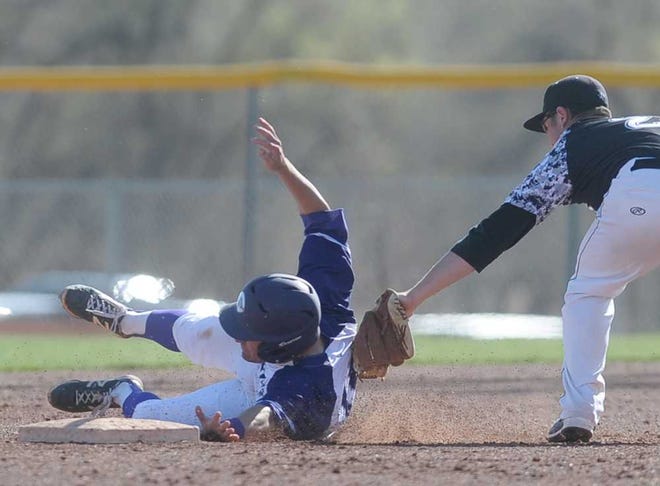 Randall's Brett Taff tags out Canyon's Cade McCallie while he attempts to reach second base Friday at Conner Park in Canyon.