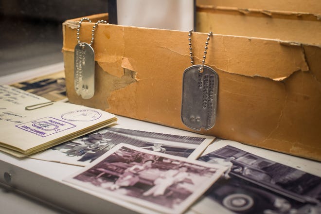 In this March 10 photo, character Don Draper’s box of secrets, including Dick Whitman’s dogtag, letters and family photos are displayed as part of the exhibition, “Matthew Weiner’s Mad Men,” at the Museum of the Moving Image in New York. The exhibit runs through June 14. The final episodes of the series will begin April 5.