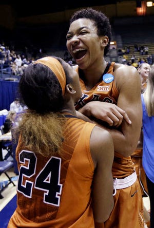 In this March 22 photo, Texas center Imani McGee-Stafford, right, celebrates with Ariel Atkins (24) after the team's 73-70 win over California in the second round of the NCAA women's tournament in Berkeley, Calif.