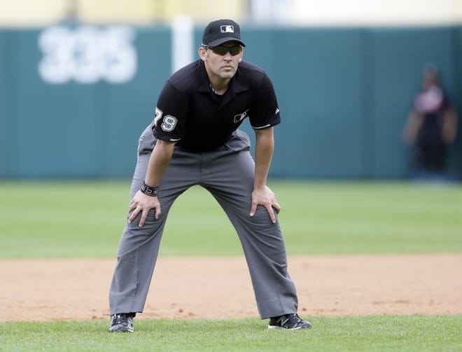 Umpire Manny Gonzalez is seen during a spring training exhibition baseball game between the Atlanta Braves and the Boston Red Sox in Kissimmee, Fla., Friday, March 27, 2015.