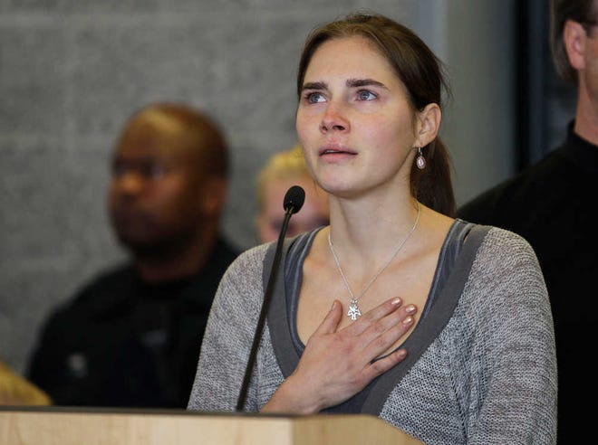 Associated Press file photoAmanda Knox gestures at a news conference in October 2011 in Seattle after returning home from Italy.