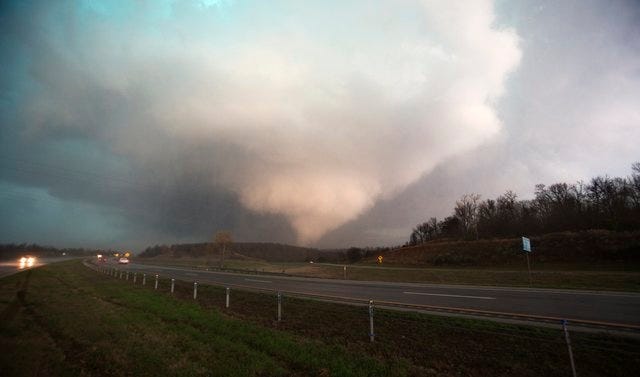 Reuters
A tornado is seen in Sand Springs, Okla., on Wednesday. A storm system produced at least three tornadoes in Arkansas and Oklahoma on Wednesday, killing one person and injuring several others, officials said.