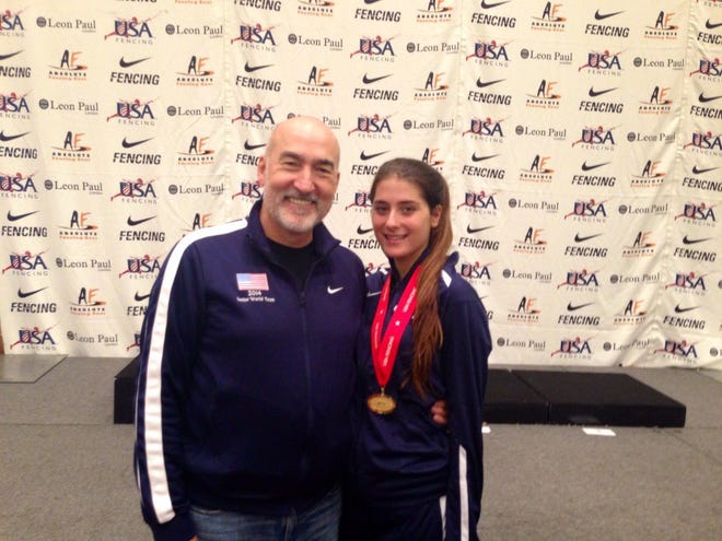 Cambridge 16-year-old Violet Michel poses with coach Zoran Tulum after she won the gold medal at the North American Cup. COURTESY PHOTO