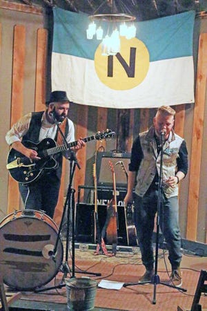 Tyler Cook, left, and Adam Agin of Neulore perform at Palace Coffee Co. in Canyon.   Visit amarillo.com for a Spotted gallery from the event. IPad users, tap the QR code for a direct link.