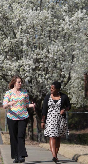 Mike Hensdill/The Gazette
Cookson Co.’s HR manager Rachel Whitaker, left, talks with Darcel Walker, the program manager for Gaston Community Healthcare Commission, as they walk together outside the Cookson facility on Tulip Drive in Gastonia on Tuesday morning.