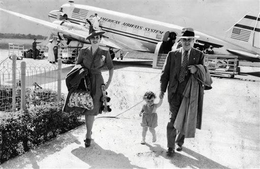 In this undated photo provided by Carolyn Chester, her parents, Edmund and Enna Chester and their daughter, Patricia, arrive in Cuba on a flight from Florida. When Fidel Castro's government began confiscating the property of thousands of U.S. citizens and companies in 1959, the Chesters lost an 80-acre farm and hundreds of thousands of dollars worth of stock. (AP Photo)