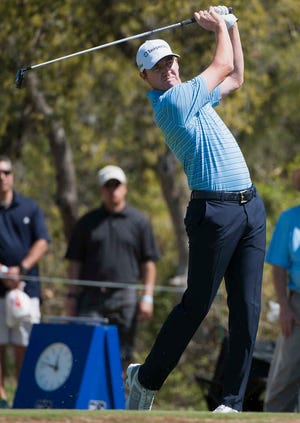 Jimmy Walker hits from the first tee during the third round of the Valero Texas Open golf tournament, Saturday, March 28, 2015, in San Antonio. (AP Photo/Darren Abate)
