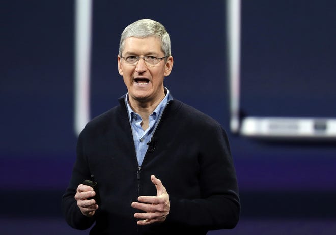 Apple CEO Tim Cook says he plans to donate much of his money to 
philanthropic causes.
AP PHOTO / ERIC RISBERG