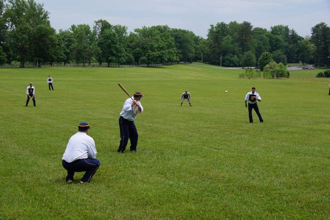 Members of The Potomacs compete in a Mid-Atlantic Vintage Base Ball League game. A base ball game played by the rules and featuring the uniforms of 1864 is one of the highlights of WaynesboroFest this summer.