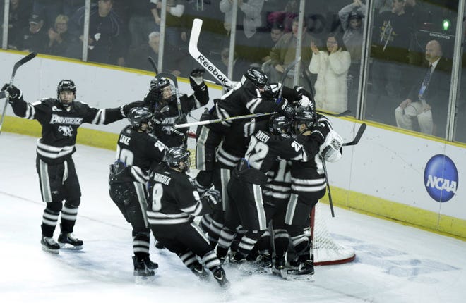 The Providence College Friars celebrate their East Region-clinching victory on Sunday night.