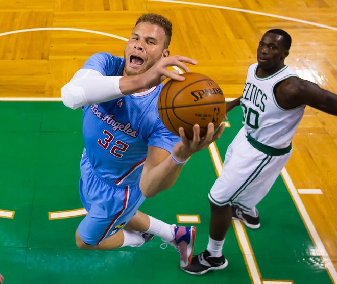 Los Angeles Clippers' Blake Griffin goes to the basket past Boston's Brandon Bass during the first half Sunday's game.