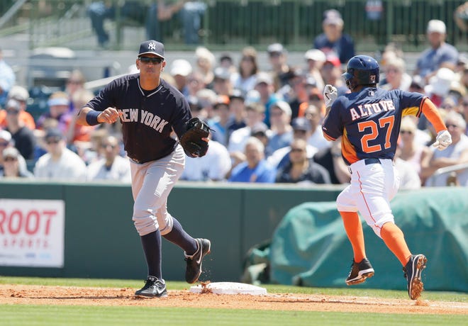 Houston's Jose Altuve is out as Yankees first baseman Alex Rodriguez takes the throw from third baseman Chase Headley in the bottom of the first inning Sunday in Kissimmee, Fla. A-Rod was playing first base for the first time in his career. The Associated Press