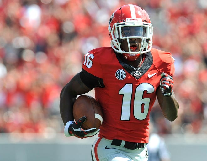 Georgia wide receiver Isaiah McKenzie (16) runs for a first down as Georgia takes on Troy at Sanford Stadium on Saturday, Sept. 20, 2014 in Athens, Ga.