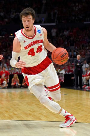 Wisconsin forward Frank Kaminsky drives to the basket against Arizona in the West Regional final Saturday in Los Angeles.