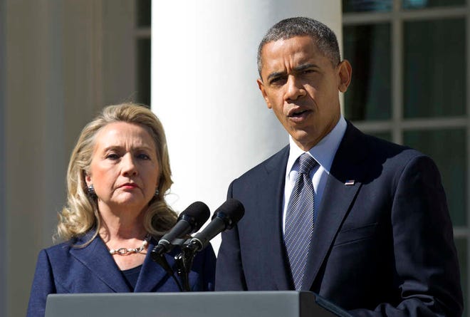 President Barack Obama, accompanied by then-Secretary of State Hillary Rodham Clinton, speaks Sept. 12, 2012, in the Rose Garden of the White House in Washington.