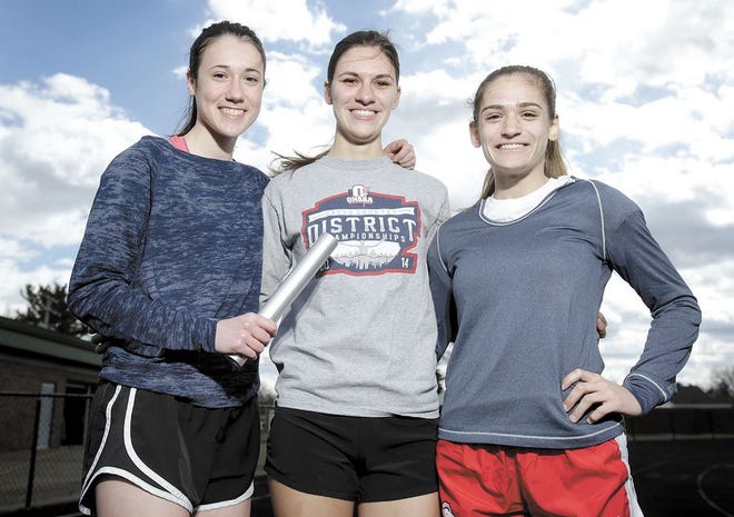 The returning members of the state qualifying Central Catholic girls 4x800 relay team: (from left) Rachel Reolfi, Sarah Paul and Megan Soehnlen.