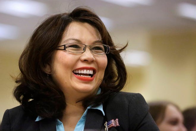 In this Aug. 13, 2014 file photo, U.S. Rep. Tammy Duckworth, D-Ill., appears at annual state fair Governor's Day brunch in Springfield, Ill. Duckworth says Monday, March 30, 2015 that she'll run for U.S. Senate in 2016, setting up a high-profile challenge to Republican Sen. Mark Kirk's re-election bid. (AP Photo/Seth Perlman, File)