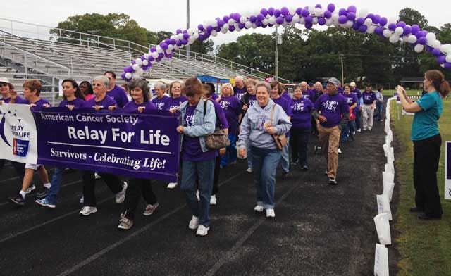 Cancer survivors take the first lap at Greene Central High School in the Greene County Relay For Life event in May. This year’s event will highlight Relay’s roots 30 years ago and will be held April 24 at the Greene County Recreation Complex.