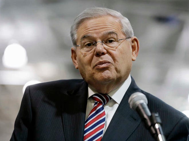 FILE - In this March 23, 2015 file photo, Sen. Robert Menendez, D-NJ, listens to a question while speaking in Garwood, N.J. Federal prosecutors are moving toward charging a Florida eye doctor over his dealings with Menendez, according to a person familiar with a Justice Department investigation into their relationship. The person said prosecutors are expected to bring charges against Dr. Salomon Melgen, whose medical offices were raided two years ago by federal authorities. Melgen has not been cooperating with prosecutors against Menendez, according to the person, who was not authorized to comment on the record about an ongoing federal investigation. (AP Photo/Mel Evans, File)