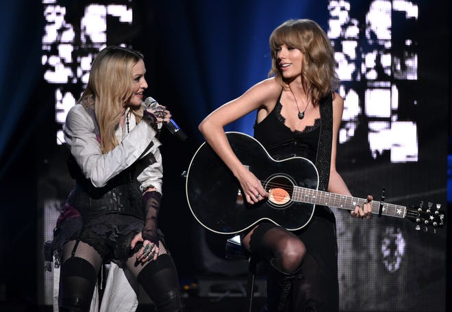 Madonna, left, and Taylor Swift, performing March 29 at the iHeartRadio Music Awards in Los Angeles. (THE ASSOCIATED PRESS)