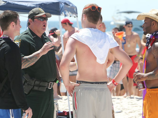 The Bay County Sheriff’s Office checks IDs during Spring Break earlier this month in Panama City Beach.