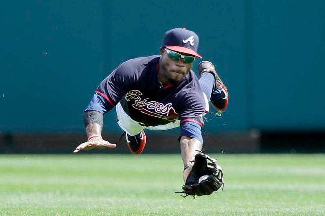 Eric Young Jr., a second baseman/left fielder, has little experience playing center field, his new position for Atlanta.