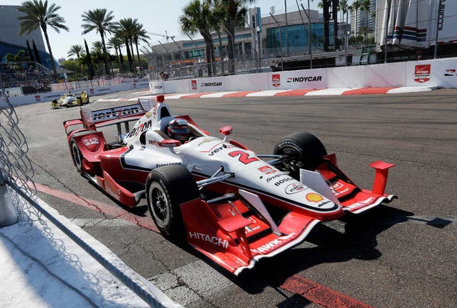Juan Pablo Montoya, of Colombia, drives out of turn 10 during the IndyCar Firestone Grand Prix of St. Petersburg auto race Sunday, March 29, 2015, in St. Petersburg, Fla. Montoya went on to win the race. (AP Photo/Chris O'Meara)