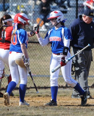 Neshaminy's Alexis Watkins (left) and Corrine Garuffe (right) congratulate each other after a score Wednesday April 1, 2015 at Souderton Area High School. Neshaminy won the game 11-5.
