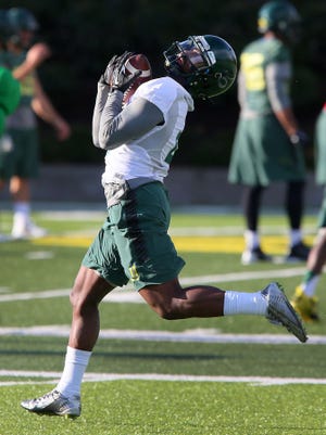 Oregon receiver Bralon Addison, who missed last season with a knee injury, hauls in a pass during Oregon’s opening day of spring practice at the Hatfield-Dowlin Complex on Tuesday. (Brian Davies/The Register-Guard)