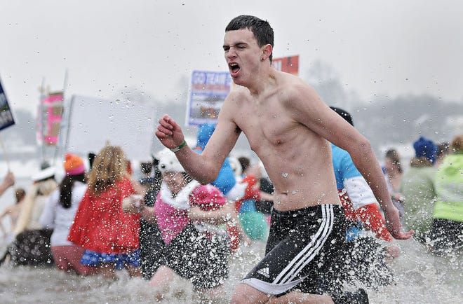 A participant in the 7th Annual Eastern Polar Plunge heads back to shore Saturday at Neshaminy State Park in Bensalem. Participants raise $50 or more to plunge their hearts out for thousands of Special Olympics Pennsylvania athletes!