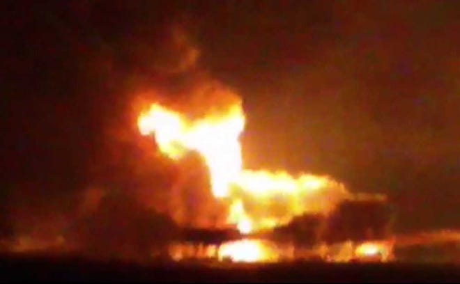 This frame grab of a video from the news station Noticias Ciudad del Carmen shows a fire burning at an oil platform in the Gulf of Mexico along the Mexican coast before sunrise on Wednesday, April 1, 2015. The fire broke out overnight at the Abkatun Permanente platform, located in the Campeche Sound, near the coast of the Mexican states of Campeche and Tabasco. (AP Photo/Noticias Ciudad del Carmen via APTN)