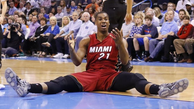 Miami Heat center Hassan Whiteside (21) reacts to an officials call during the first half of an NBA basketball game against Miami Heat in Oklahoma City, Sunday, March 22, 2015. (AP Photo/Alonzo Adams)