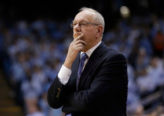 FILE - In this Jan. 26, 2015, file photo, Syracuse coach Jim Boeheim watches during his team's NCAA college basketball game against North Carolina in Chapel Hill, N.C. Syracuse was put on probation for five years and Boeheim got a nine-game suspension for violations that included failure to adhere to a drug-testing program that was deemed too confusing by school administrators. The NCAA recommends schools adopt their own drug policies but can then sanction schools for not following them. (AP Photo/Gerry Broome), File