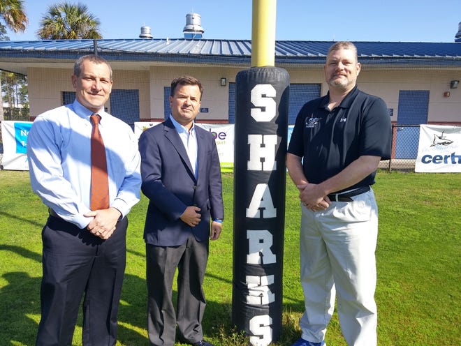 From left: Ponte Vedra High School Principal Steve McCormick, Advanced Disposal CEO Richard Burke and PVHS Athletic Director David Scott.