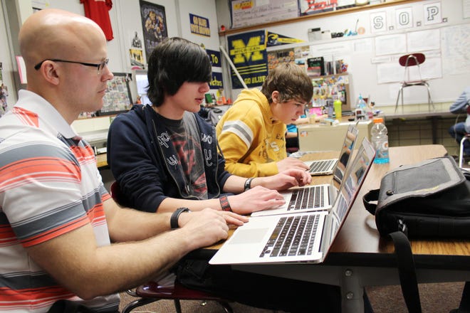UCHS teacher Steve Brown helps junior Jacob Ross with a question he has with his coding project. Spencer Lahr Photo