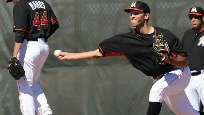 Miami Marlins closer Steve Cishek, delivering a pitch during a spring training workout last month, has converted 87 of 94 save opportunities since 2012. “To have him down there is huge,” manager Mike Redmond said of Cishek. (Bill Ingram / Palm Beach Post)