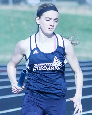 Ridgewood’s Megan Reed, pictured running the final leg of the 4x800 relay Thursday at Kewanee, is the Star Courier’s Athlete of the Week.