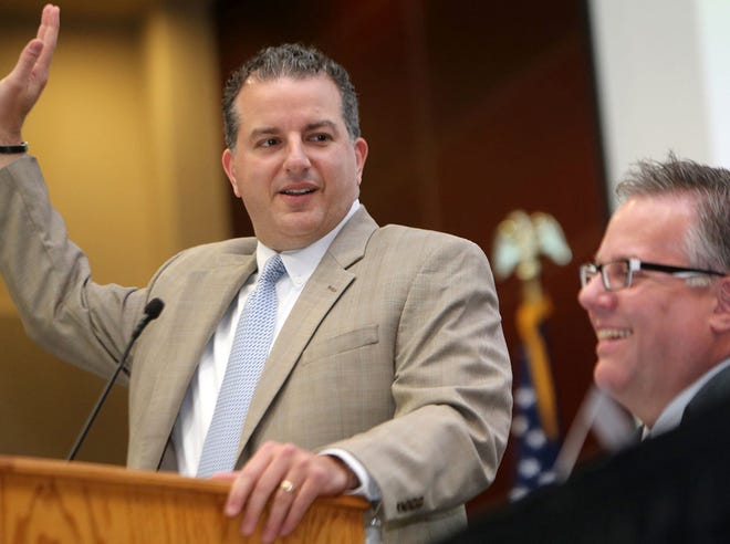 From left, Jimmy Patronis, who serves on the Florida Public Service Commission, jokes around with Shawn McNeil at the monthly Bay County Chamber of Commerce “First Friday” meeting at Florida State University Panama City.