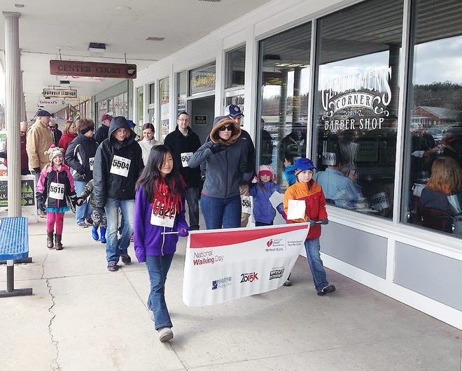 Community members took a step toward heart health on Saturday to celebrate National Walking Day. Dozens of walkers joined the American Heart Association for a ceremonial walk at the New Hartford Shopping Center Saturday afternoon. SUBMITTED PHOTO