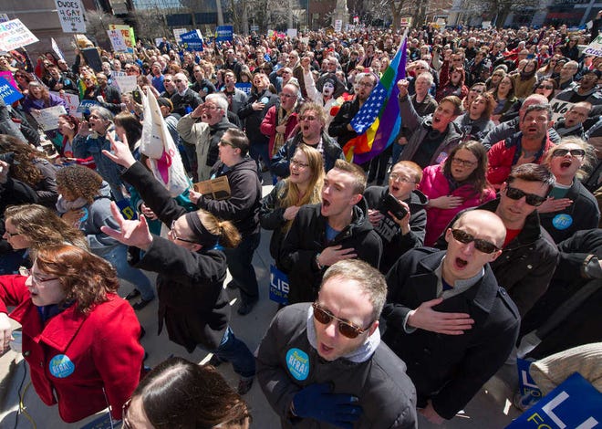 Thousands of opponents of Indiana Senate Bill 101, the Religious Freedom Restoration Act, gather for a protest on the lawn of the Indiana State House on March 28.