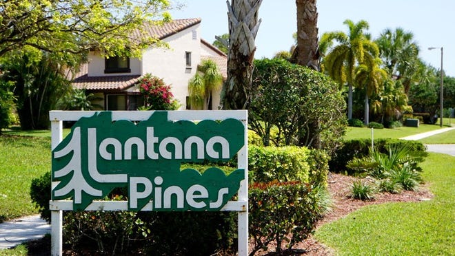 The entrance sign inside the Lantana Pines neighborhood. (Richard Graulich / The Palm Beach Post)
