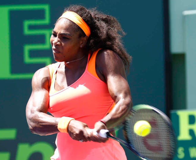 Serena Williams hits a return to Carla Suarez Navarro, of Spain, during the women's final at Miami Open tennis tournament in Key Biscayne, Fla., Saturday, April 4, 2015. Williams won 6-2, 6-0. (AP Photo/J Pat Carter)