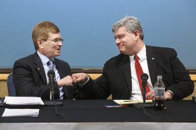 Springfield mayoral candidates Jim Langfelder, left, and Paul Palazzolo fist bump at the conclusion of a March 23 debate at The State Journal-Register. File/The State Journal-Register